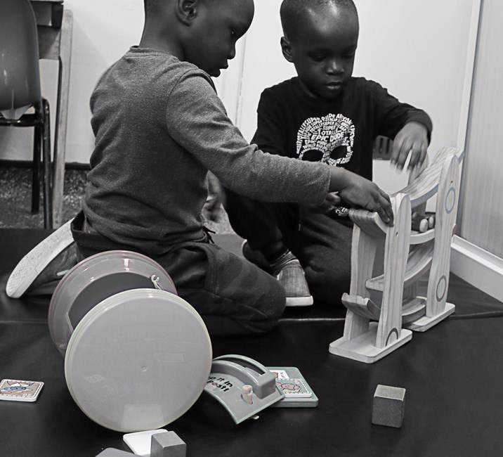 Two children playing with toys