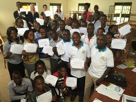 group of people holding certificates