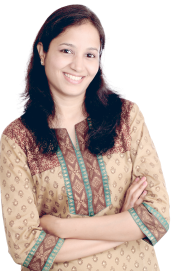 Woman smiling at the camera with arms folded