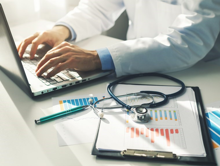 Health worker at a computer