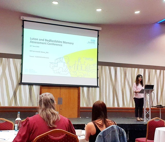 A speaker addressing the audience at the conference