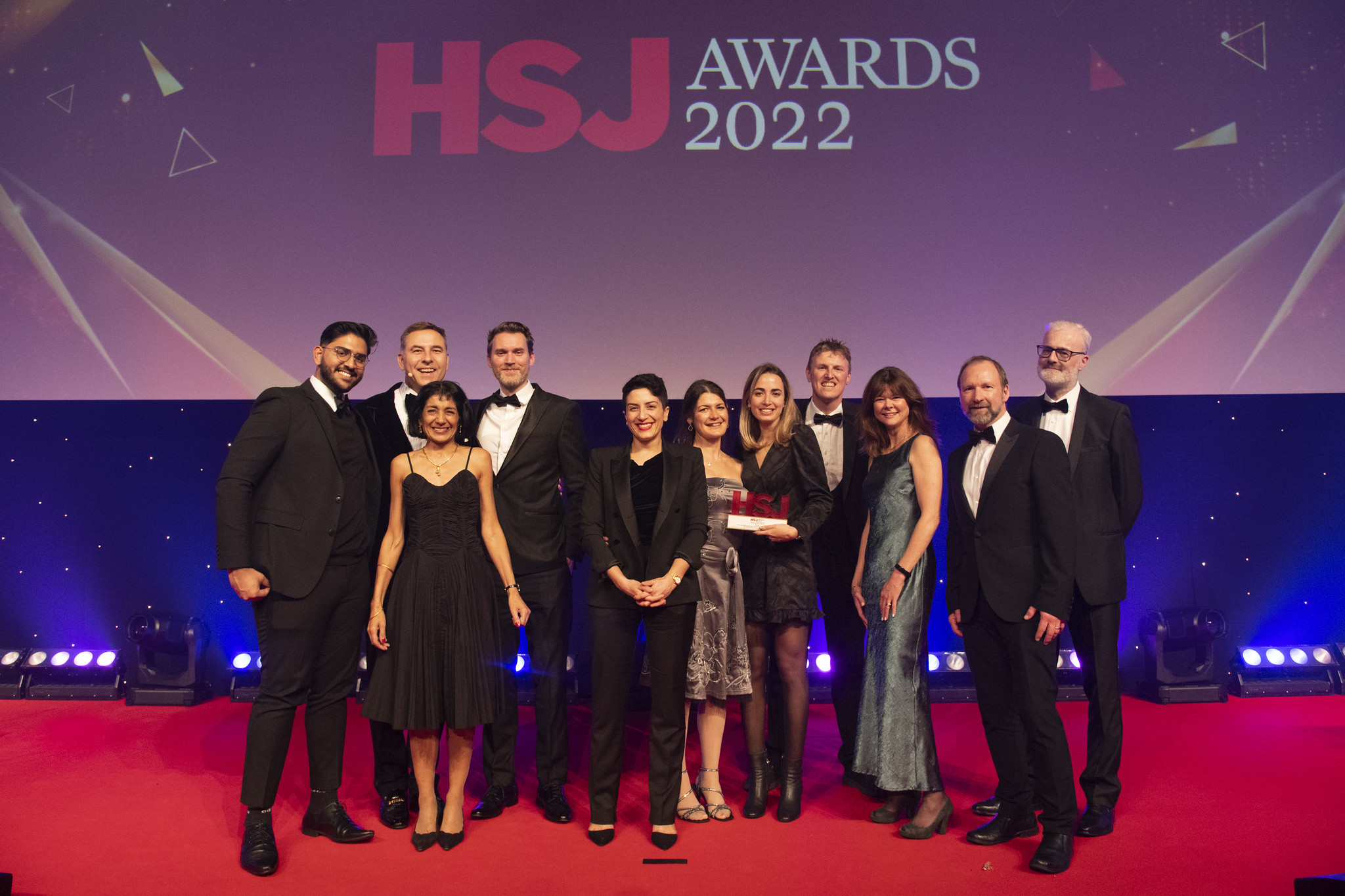 THE CAPs team collecting their HSJ Award