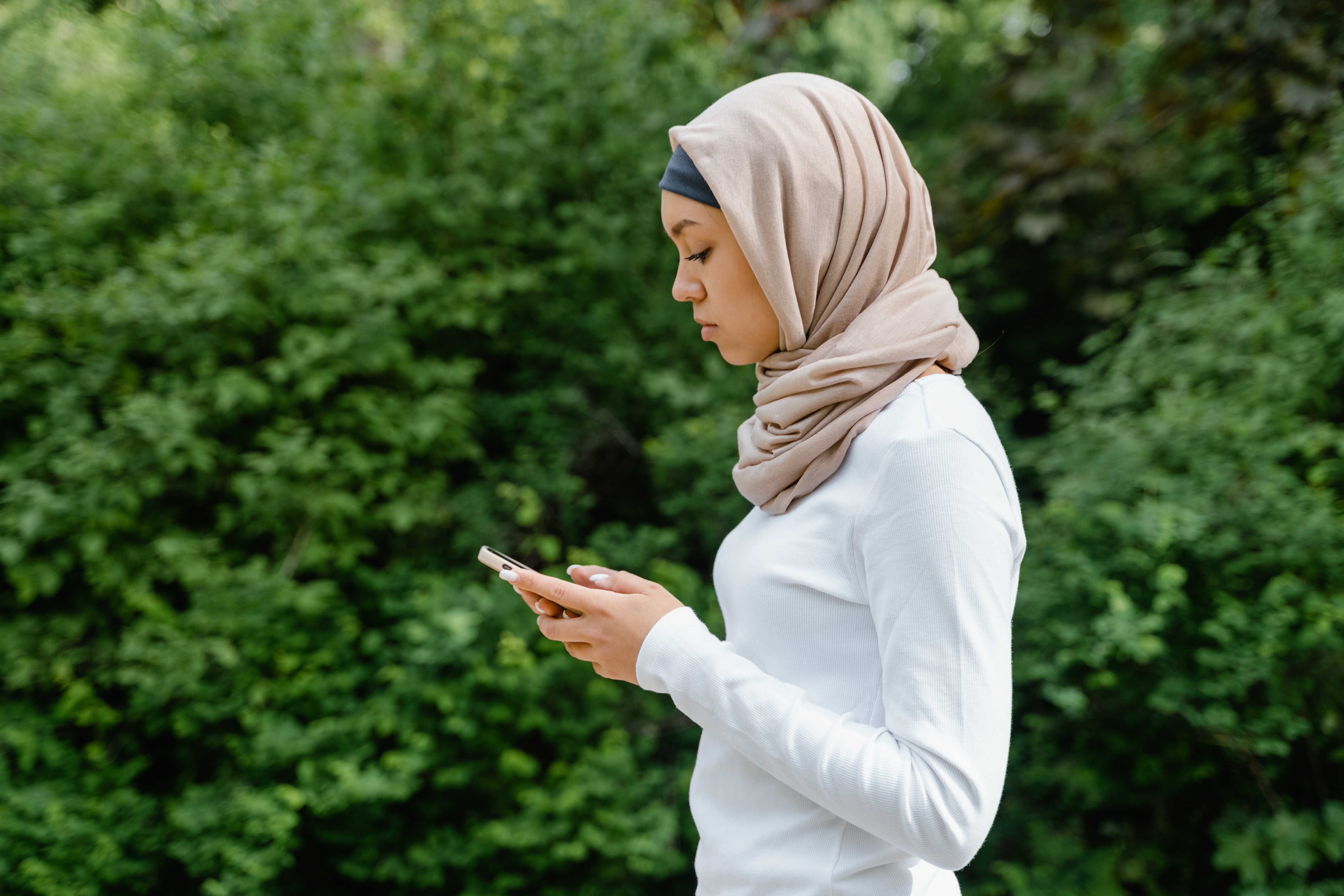 Young Hijabi/Muhajabah on her phone