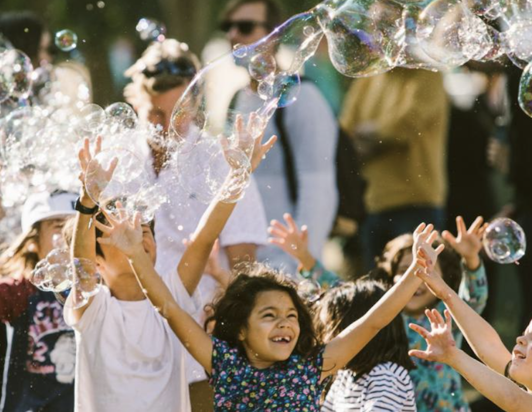 kids playing with bubbles