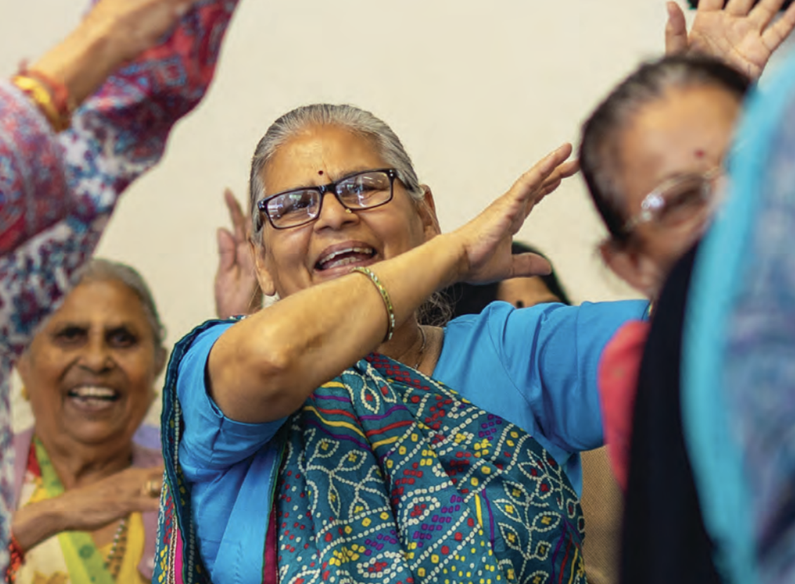 dancing ladies wearing saries