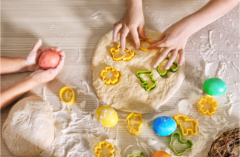 Children playing with pizza dough 