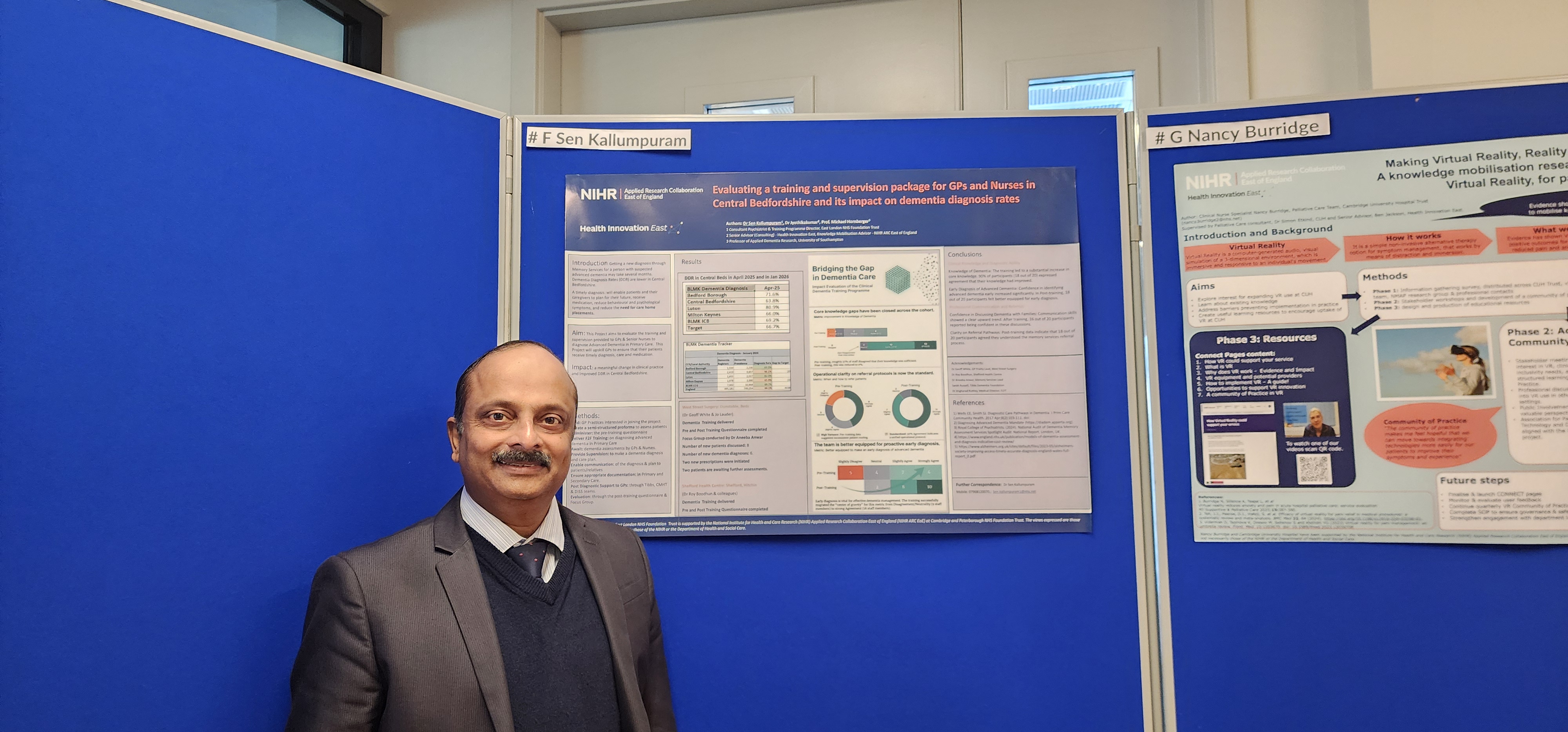 Dr Sen Kallumpuram in front of his poster presentation.