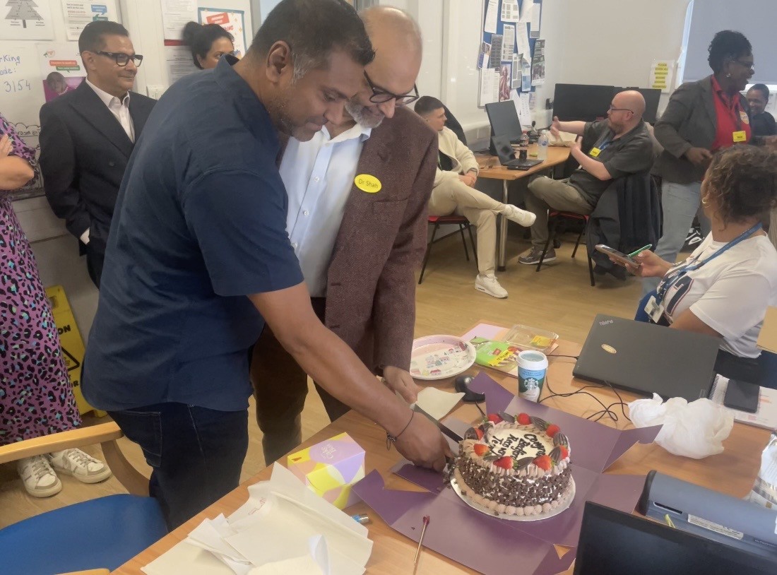 Bedford Adult Community Health Team cutting the cake to celebrate being shortlisted at the RCPsych Awards