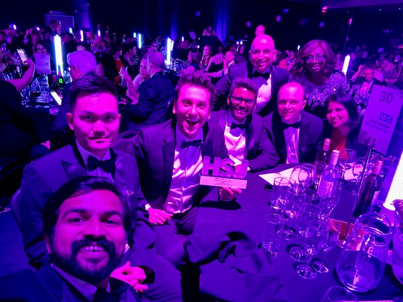 Data & Analytics Team sitting at their table with their HSJ Digital Award.