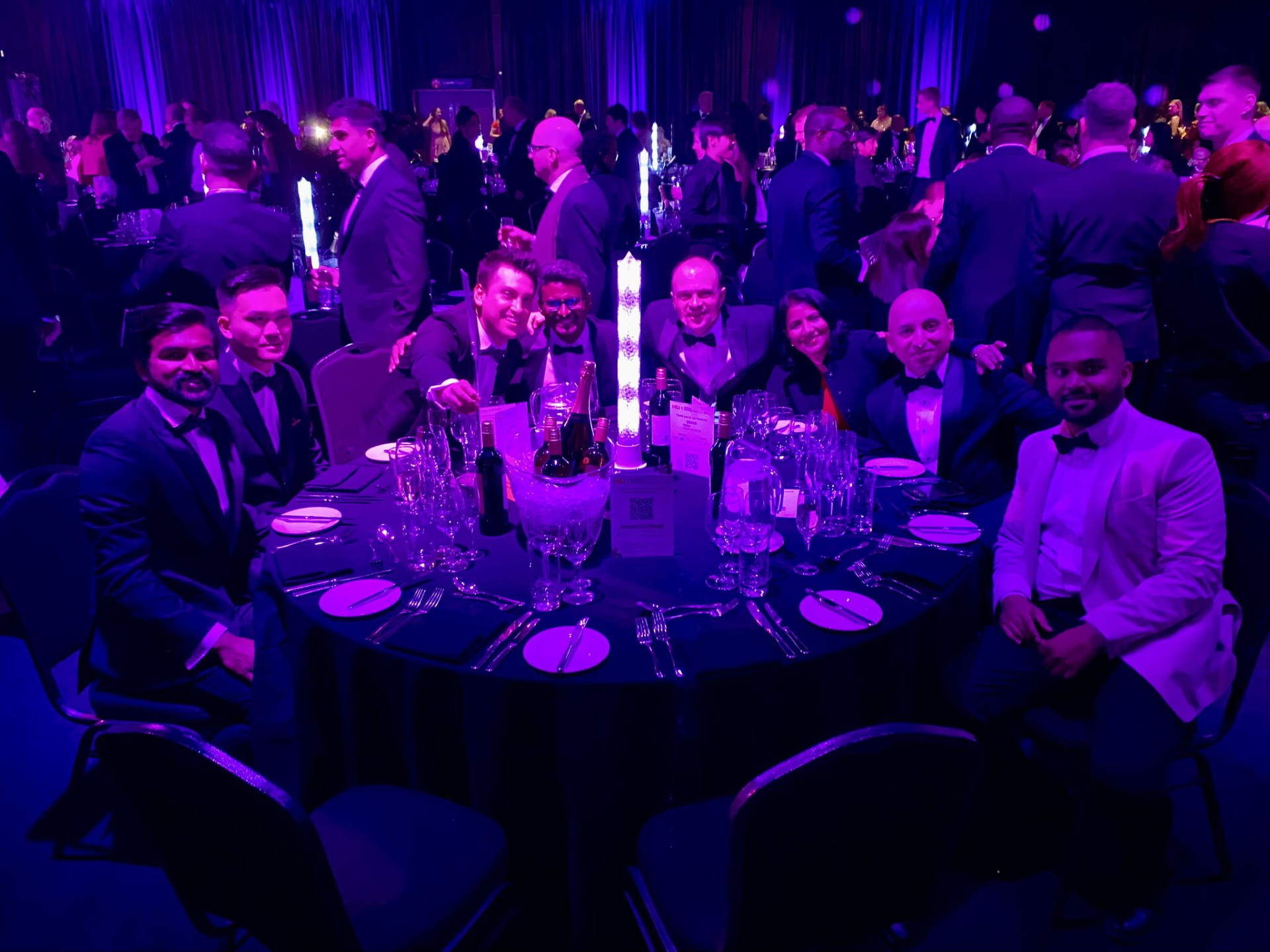 Data & Analytics Team sitting at their table. 