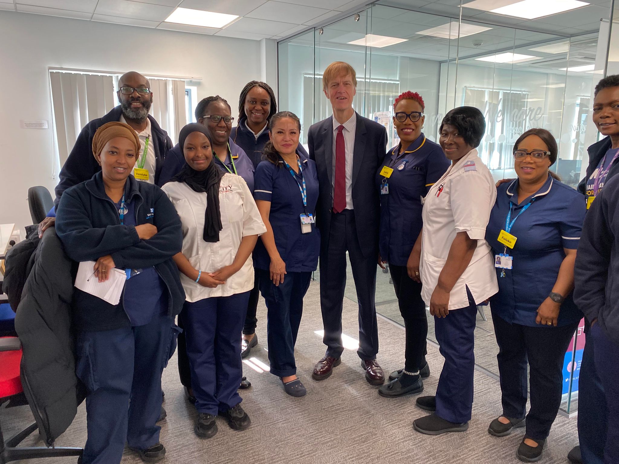 Sir Stephen Timms MP standing next to staff from the Urgent Care Response (UCR) team.