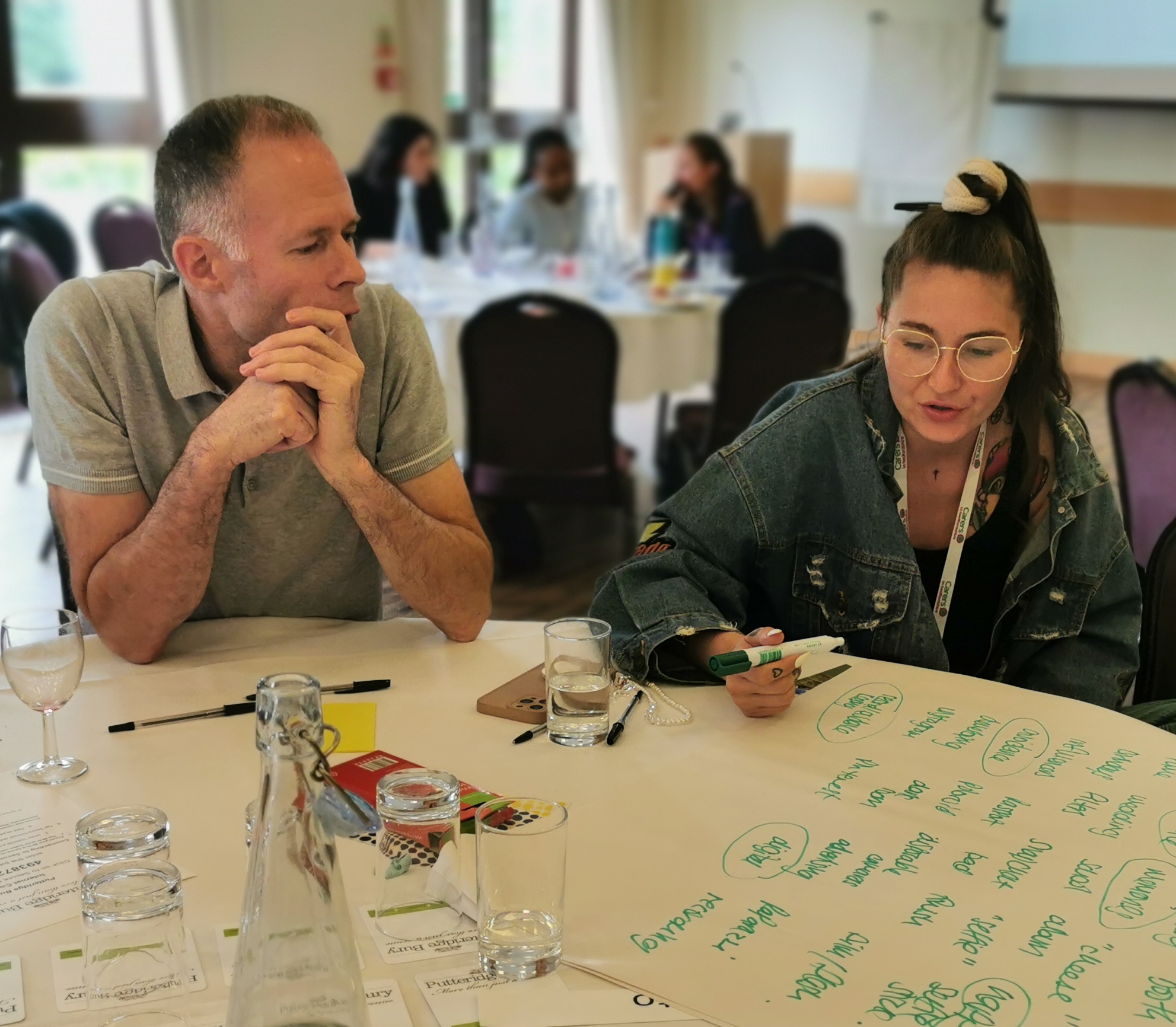 Guests discussing ideas at the forum