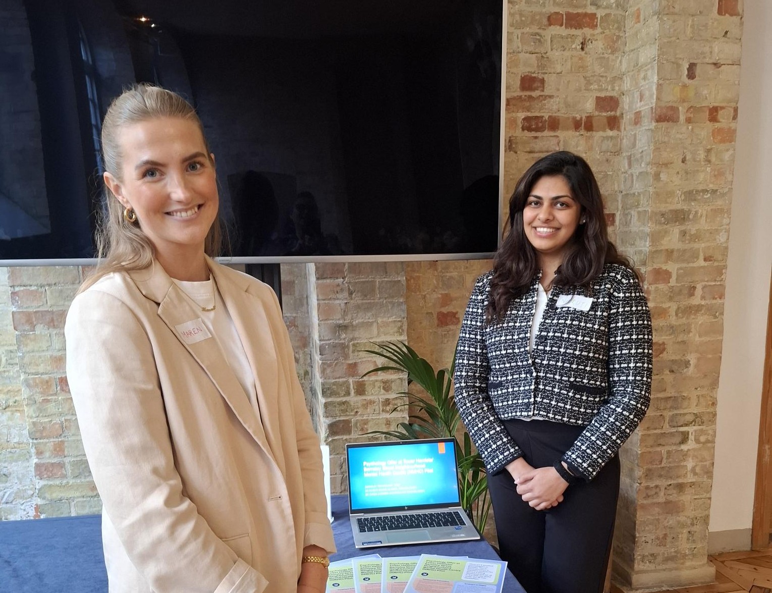 Colleagues presenting their poster at the conference