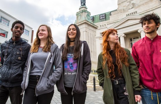group of teenagers laughing