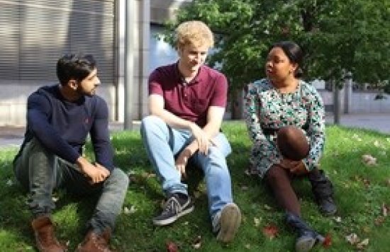 3 people chatting on a mound