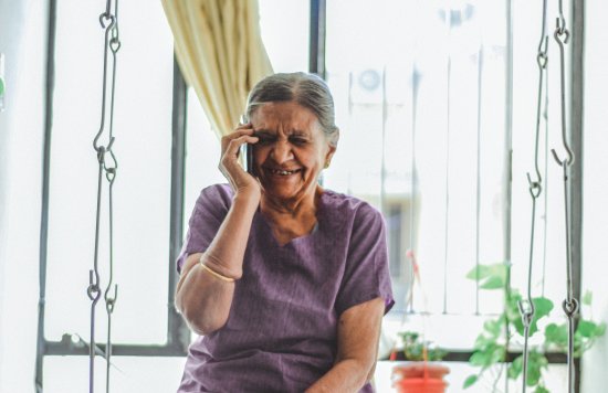 Photograph of a woman talking on the phone