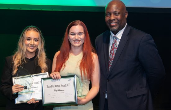 Award-winning apprentices Phoebe and Lucy with Edwin Ndlovu