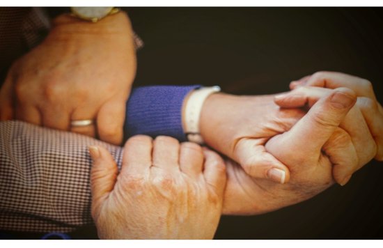 Arms linked to symbolise unity 