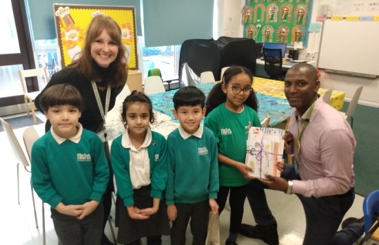 Pupils from Brick Lane Primary School with Alan Strachan