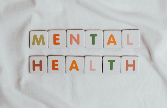 Coloured letter blocks spelling mental health