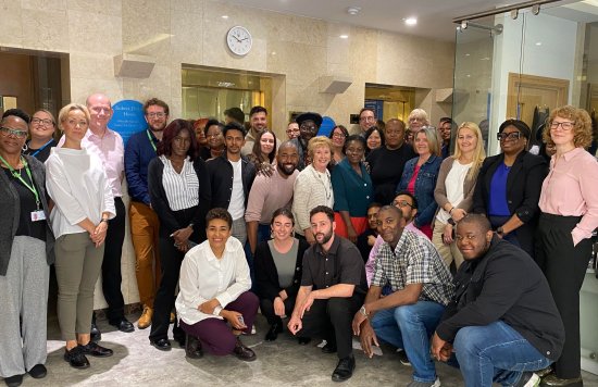 Forty staff huddled in reception for plaque unveiling