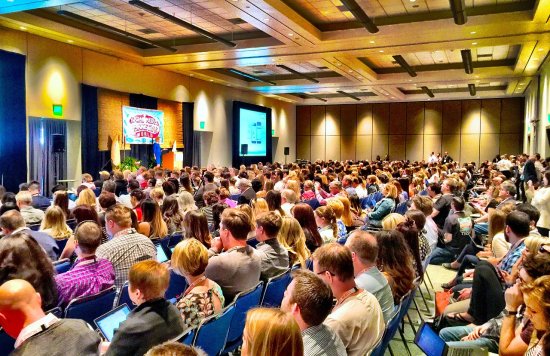 Stock image of people attending a conference.