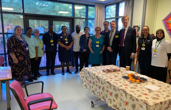 Sir Stephen Timms MP standing next to staff at the East Ham Care Centre.