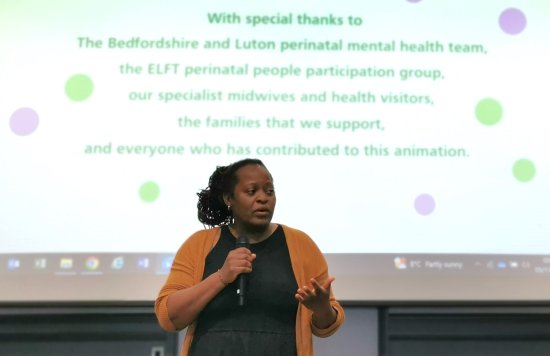 Lorraine Sunduza speaking at the perinatal event