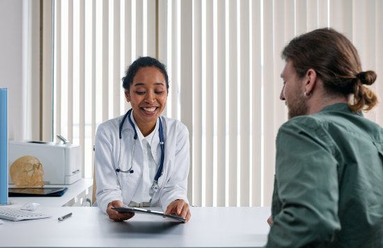 Stock image of a doctor talking to a patient.