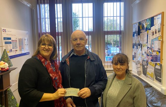 Mr and Mrs Bibby present cheque to Carla Lewinton