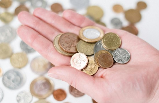 Someone holding coins