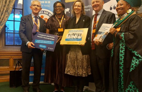 Lucia Vambe with government officials- Universal Health Coverage Day