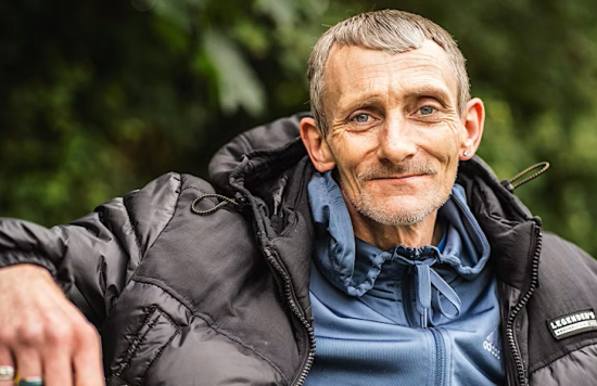 an image of an older man smiling 