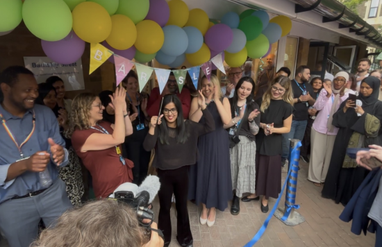 A service user cutting the ribbon to open the Barnsley Street Neighbourhood Mental Health Centre.