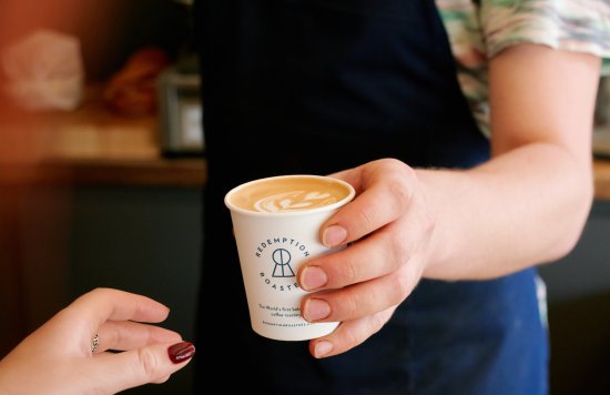 Handing over cup of coffee