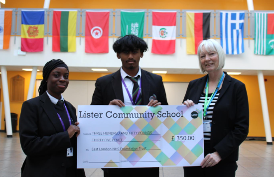 Two school pupils present cheque to ELFT manager