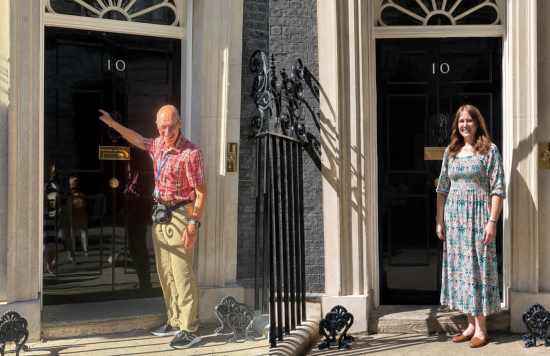 Anna Lipinska and Peter Spelman standing outside 10 Downing Street.