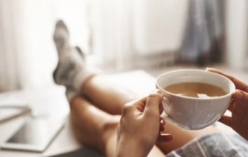 relax with hot drink and feet up