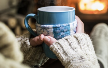 cosy home with fire, sweater, mug