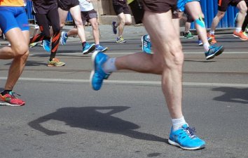 Legs in a group of runners