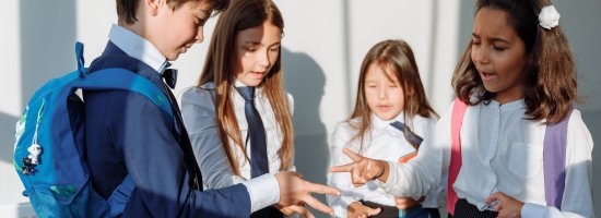 Group of Children playing scissor paper rock