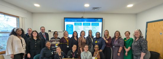 Group of staff huddled together