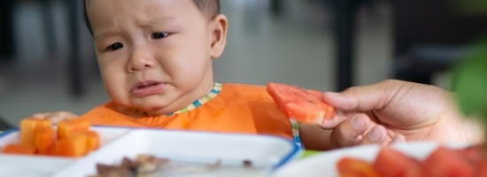 child refusing watermelon